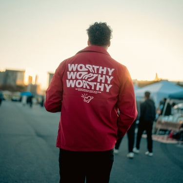 Worthy red windbreaker jacket by Mistakes Made, faith-inspired design