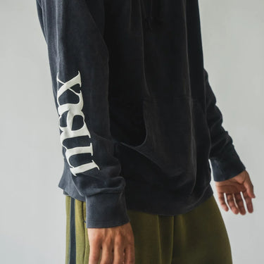 Oversize vintage washed hoodie with full back print. On the back is a verse from the Quran talking about God's mercy. Sleeve print has the brand's logo on it. Front small logo embroidery in pink. 