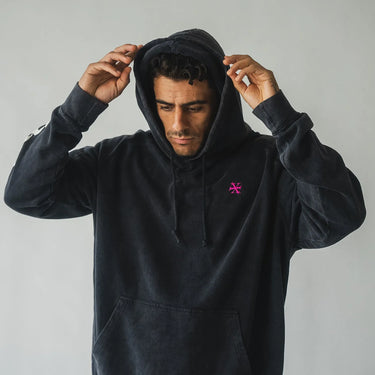 Oversize vintage washed hoodie with full back print. On the back is a verse from the Quran talking about God's mercy. Sleeve print has the brand's logo on it. Front small logo embroidery in pink. 