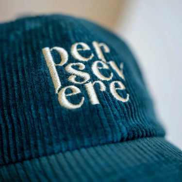 CORDUROY ARMY GREEN HAT with the word persevere embroidered on it. cool stylish trendy fashion.